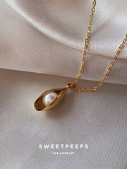 Pearl In Clam Necklace